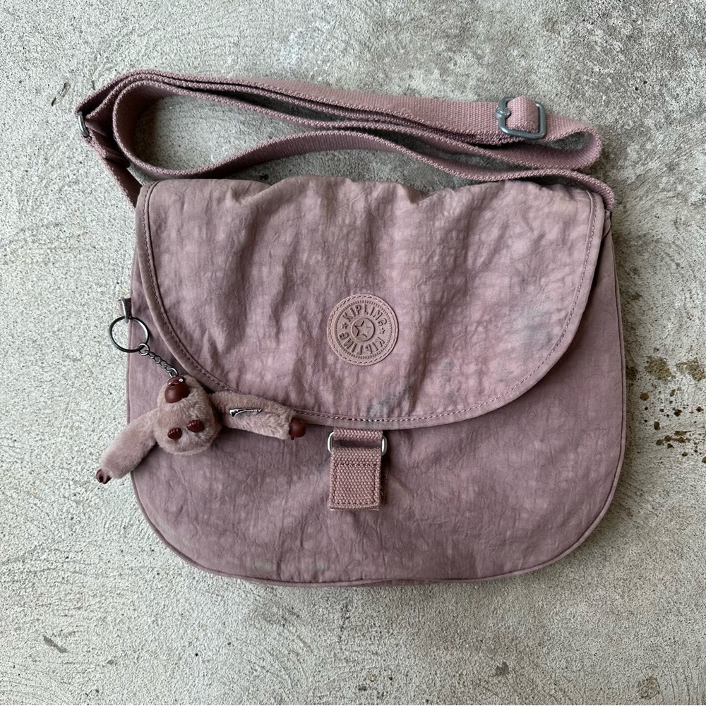 Pink Kipling crossbody bag with monkey charm